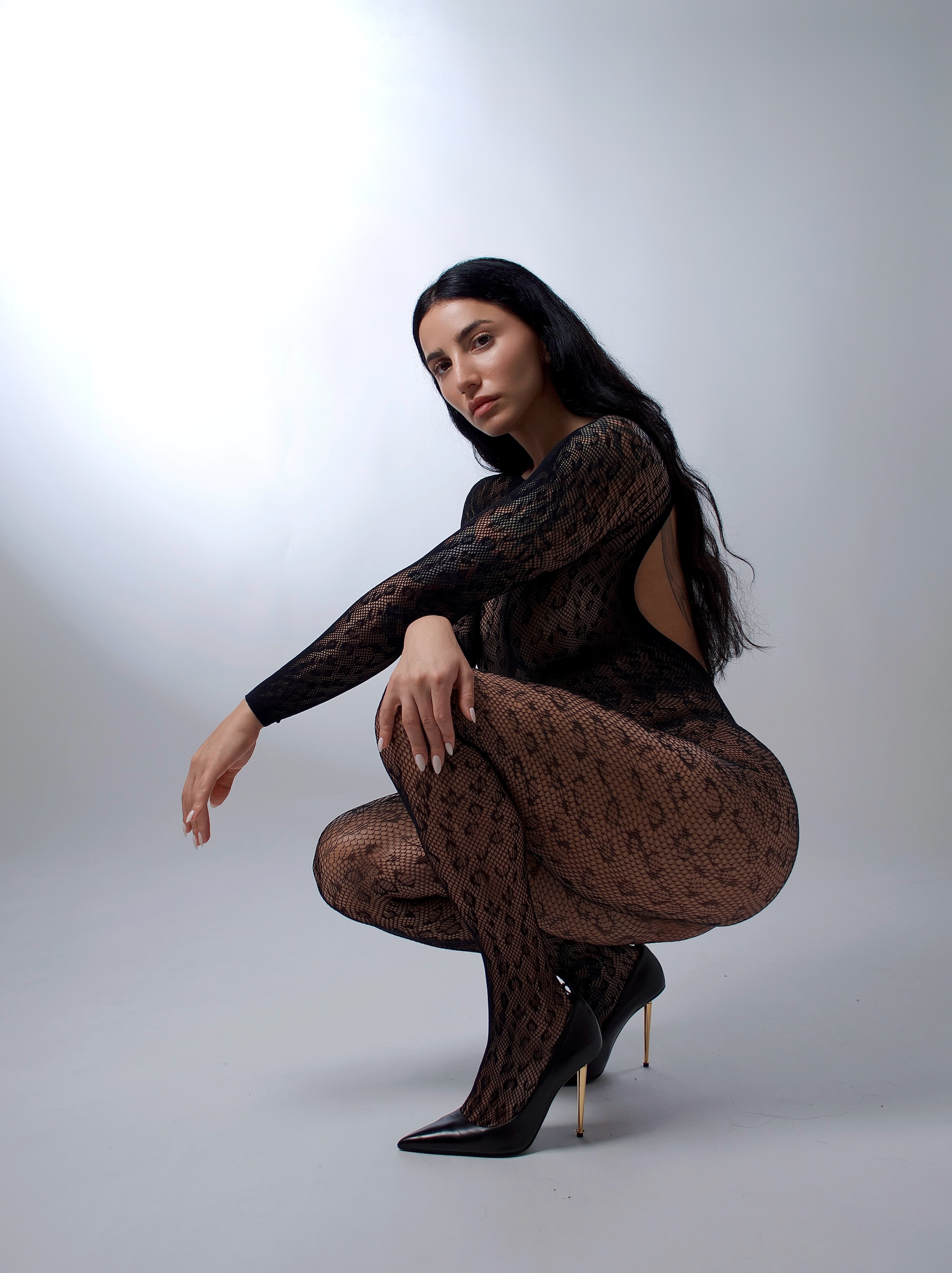 Black lace, crouched pose, studio